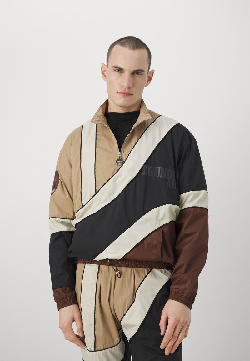 Ahluwalia ABUJA TRACK UNISEX Tuulejope camel/kaamelipruun Zalando.ee