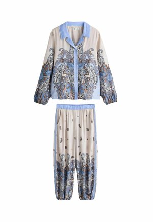 Long-sleeve button shirt and loose pants with blue collar and paisley patterns in blue, brown, and beige tones on sleeves and pant legs.