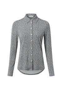 Long-sleeve button-up shirt in blue with a floral pattern. Features a pointed collar and a curved hem. Made from a lightweight fabric.