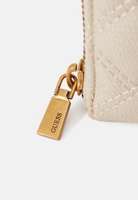Guess GIULLY beżowy