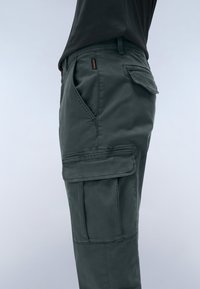 Cargo pants in dark gray cotton with a side pocket, smooth texture, and straight cut. Features a visible logo on the waistband.