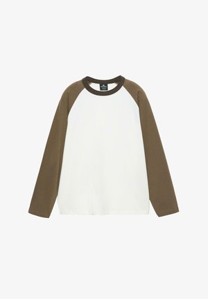 Cămașă cu mâneci lungi, corp alb și mâneci raglan maro. Confecționată din bumbac, are guler rotund și croială lejeră.