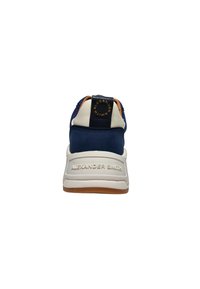 Marineblauer Sneaker mit weißer Zwischensohle und beigen Akzenten. Verfügt über ein strukturiertes Obermaterial und ein rundes Logo an der Ferse. Gummisohle für guten Grip.