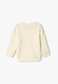 Helles gelbes, geripptes Sweatshirt mit Rundhalsausschnitt und überschnittenen Schultern. Lange Ärmel und ein gerader Saum hinten.