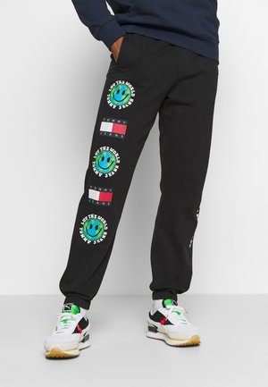 LUV THE WORLD UNISEX - Tracksuit bottoms - black