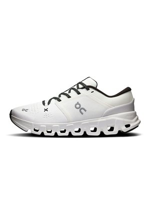 White athletic shoe with black and white laces, black inner lining, ventilated upper, and distinctive segmented sole for cushioning and support.