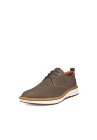 Scarpa in pelle marrone con lacci, punta rotonda, suola bianca testurizzata e cuciture decorative marroni. Presenta una fascetta sul tallone per un facile indossamento.