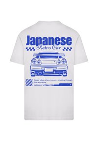 White t-shirt featuring a blue graphic of a retro car, with text "Japanese Retro Car" and striped accents below the car design.