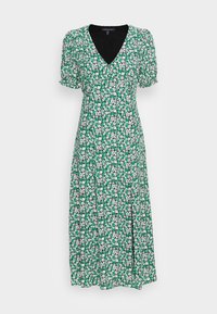 Zelené květinové šaty s V-výstřihem, krátkými nabíranými rukávy a bočním rozparkem. Na zeleném pozadí se nacházejí bílé a růžové květiny.