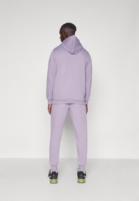 Puma LOGO - Pantaloni sportivi - pale plum