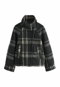 Manteau en laine à carreaux gris foncé et crème, avec un col haut, des manches larges et deux poches avant. Tissu texturé à finition douce.