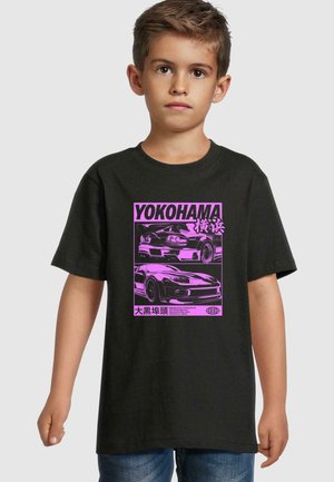 Black cotton T-shirt featuring a pink graphic of two cars with Japanese text, set within a rectangular design. Short sleeves and crew neck.