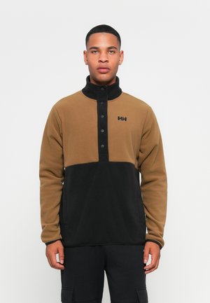 Brown and black fleece pullover with a high collar, snap-button closure, and logo detail on the chest. Smooth texture and sporty design.