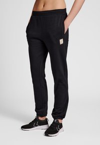 Hummel - Tracksuit bottoms - black Thumbnail Image 1