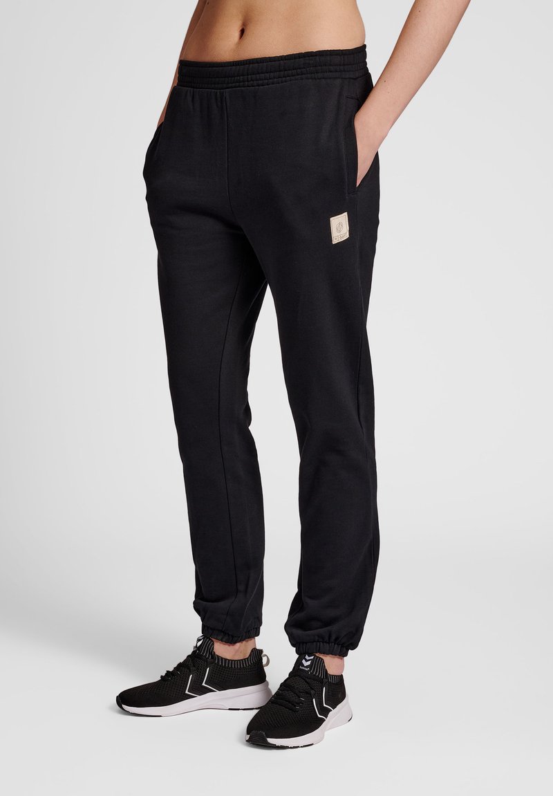 Hummel - Tracksuit bottoms - black, Enlarge
