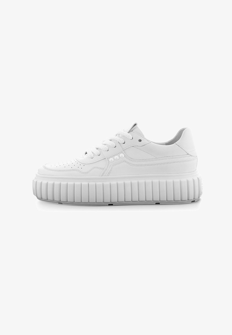 White platform sneakers with a smooth, leather-like upper, round laces, and a ridged, chunky outsole. Perforated details on the toe.