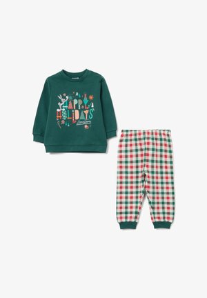Toddler's green holiday sweatshirt with Bugs Bunny print and "Happy Holidays" text, paired with red, green, and white checkered pants.