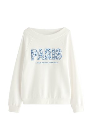 Witte sweater met lange mouwen en een brede halslijn, met een blauw bloemenpatroon en de tekst "PARIS" en kleinere tekst "where dreams come true".