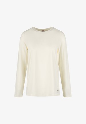 Langärmliges cremfarbenes Hemd aus weichem Stoff. Es hat einen runden Ausschnitt und ein kleines Logoschildchen an der unteren linken Seite. Glatte Textur.