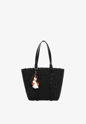 Sort vævet tote-taske med læderhåndtag og dekorative frynser med skaller og perler, der hænger fra en strop.