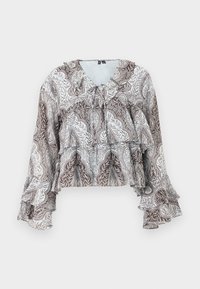 Blouse à manches longues brun et blanc avec motif cachemire, poignets à volants, détails à volants superposés et petit nœud au niveau de l'encolure.