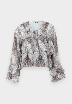 Blouse à manches longues brun et blanc avec motif cachemire, poignets à volants, détails à volants superposés et petit nœud au niveau de l'encolure.