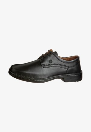 Chaussure en cuir noir avec un design à lacets, bout arrondi, couture décorative et une semelle en caoutchouc texturé pour une bonne adhérence. Style classique et simple.
