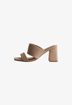 Beige suede open-toe mule sandal with two wide straps and a chunky block heel.