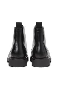 Black leather ankle boots featuring a smooth finish, elastic side panels, and a chunky sole with a tread pattern.