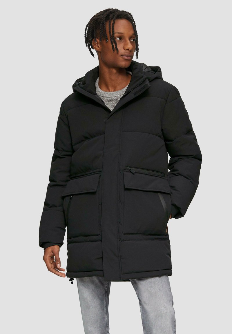 Black padded coat with a hood, featuring a zipper and button closure, two front pockets, ribbed cuffs, and a relaxed fit.