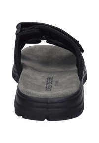 Zwarte sandalen met een gestructureerde band, zachte grijze binnenzool en een stevige rubberen zool, voorzien van klittenbandsluitingen voor een verstelbare pasvorm.