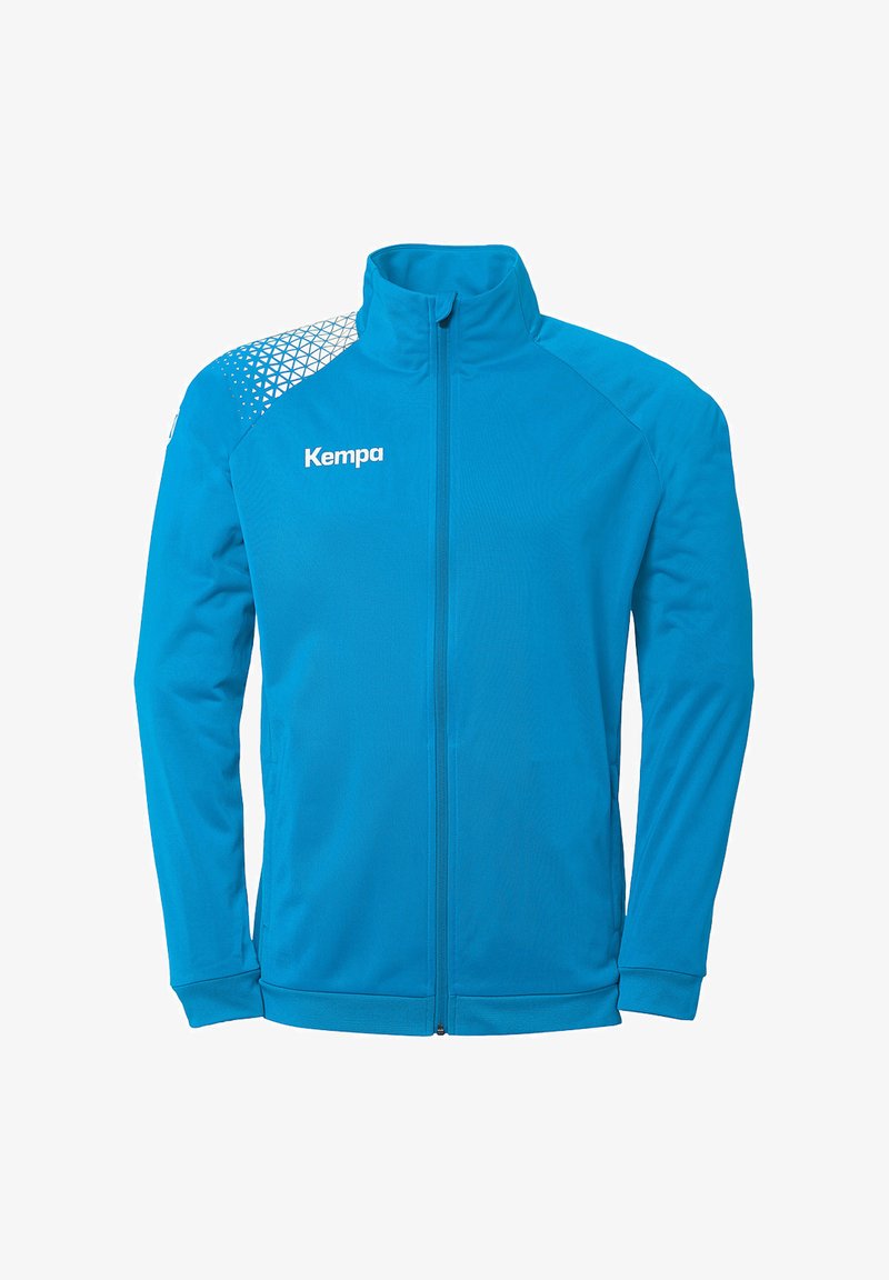 Blauwe zip-up jas met een hoge kraag, voorzien van een geometrisch patroon op de schouder en het 'Kempa' logo op de borst. Glad textuur.