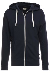 Námořnicky modrá mikina na zip s bílými šňůrkami, předními kapsami, žebrovanými manžetami a lemem. Měkká bavlněná směs s hladkou strukturou.
