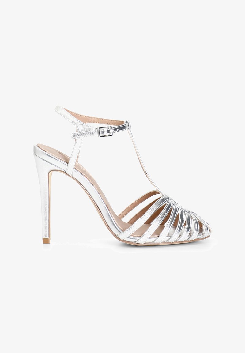 Silver high-heeled sandals with an open-toe design, featuring multiple straps and an ankle buckle. Smooth metallic finish and pointed shape.