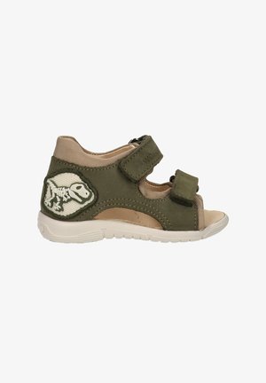 Groene toddler sandaal met twee verstelbare bandjes, open teen, zachte beige voering en een patch met dinosaurus skelet op de hiel.