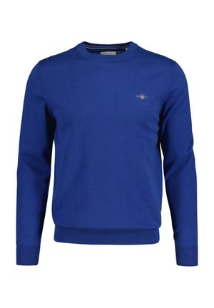 Blauwe gebreide trui met lange mouwen en geribde manchetten; heeft een klein logo op de borst. Klassiek ronde hals ontwerp. Zachte textuur.