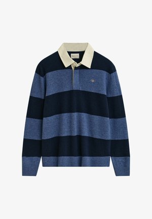 Marinblå och ljusblå randig tröja med en krämfärgad krage, tillverkad av mjukt material. Har en liten broderad logotyp på bröstet.
