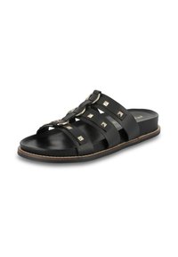 Black slide sandals featuring multiple cross straps, metallic studs, and a flat sole with a textured finish. Designed for easy wear.