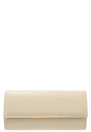 Beige suorakaiteenmuotoinen kädessä kannettava laukku, jossa läppäkansi ja etuosassa keskellä kultainen metallikoriste, johon on kaiverrettu "BUFFALO".