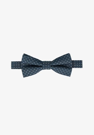 Navy blue bow tie with a textured fabric, featuring a repeating circular pattern in light blue and white. Adjustable strap for fit.
