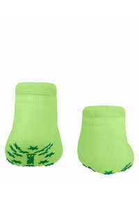 Grüne Baumwollsocken mit einem gerippten Bündchen. Sie besitzen eine strukturierte Sohle mit einem Blattmuster. Knöchellang mit einer engen Passform.