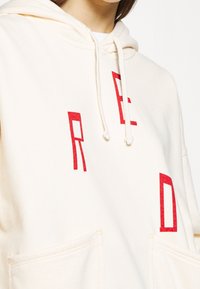 Levi's® Jersey con capucha - off-white