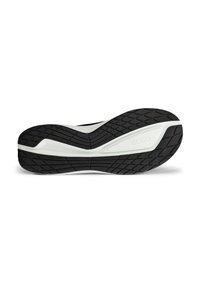 Svart og hvit såle av joggesko med et teksturert gripmønster, med et distinkt ryggekonstruksjon og logodetalj på siden.