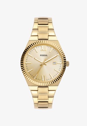 Montre-bracelet dorée avec un cadran rond, marqueurs d'heure en chiffres romains, lunette texturée, et un bracelet en métal à maillons. Affiche la date.