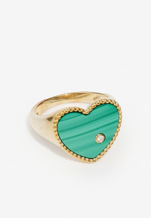 Gold ring with a heart-shaped malachite green stone and a small clear gemstone. Features rope detailing around the stone edge.
