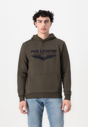 Olive green hoodie with a front pocket, featuring navy blue embroidered text and wing graphics. Soft fabric with a relaxed fit.