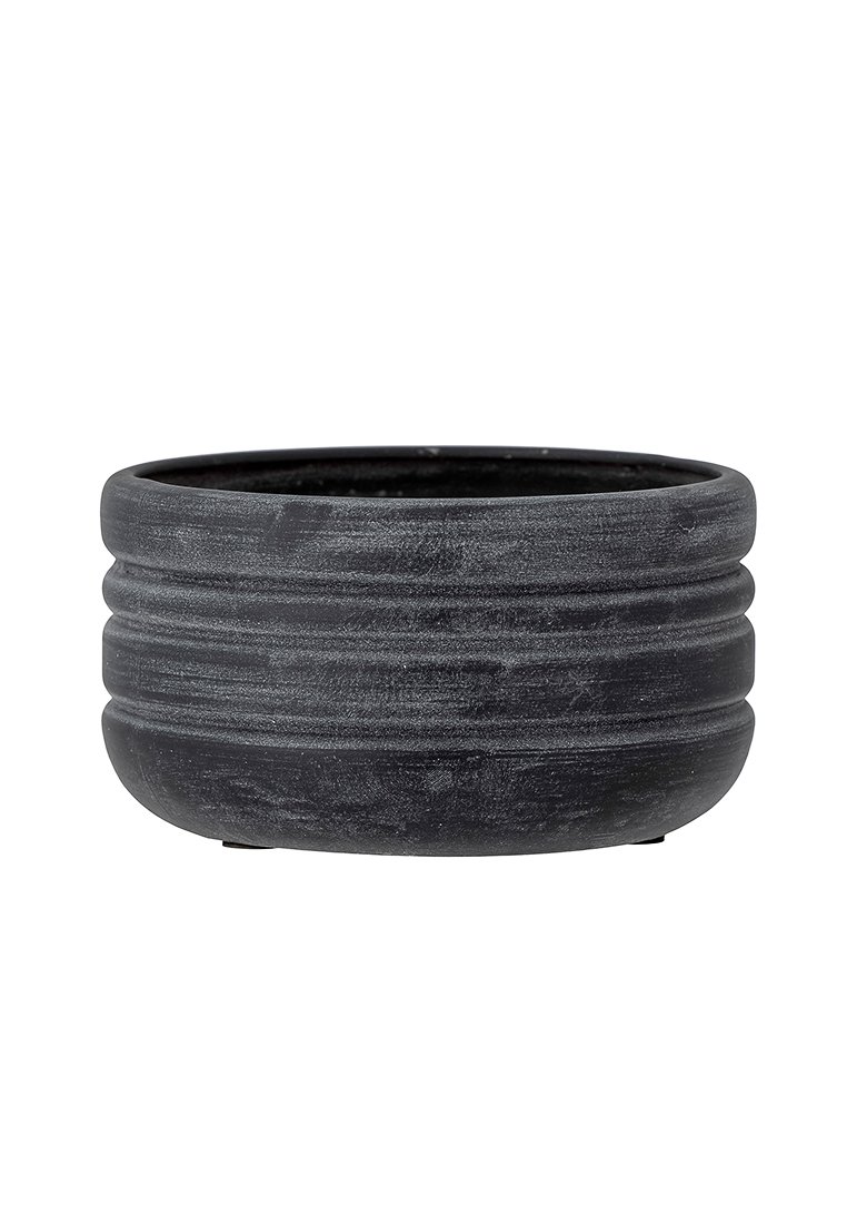 Fioriera rotonda in ceramica nera con un'esterno texturizzato caratterizzato da scanalature orizzontali e una superficie interna liscia. Non sono visibili fori di drenaggio.