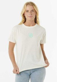 T-shirt in cotone color crema con colletto rotondo e maniche corte, caratterizzato da un piccolo design circolare verde menta sul petto.