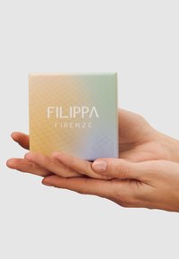 Square box packaging with a gradient effect in pastel colors, featuring a textured finish and the text "FILIPPA FIRENZE" on the front.