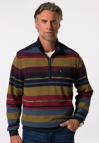 Męski rozpinany półgolf w pionowe paski w kolorach granatowym, bordowym, musztardowym i turkusowym. Teksturowana tkanina, ściągacze przy rękawach oraz detale kieszeni na klatce piersiowej.